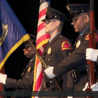 police_officers_holding_flags_in_ceremony