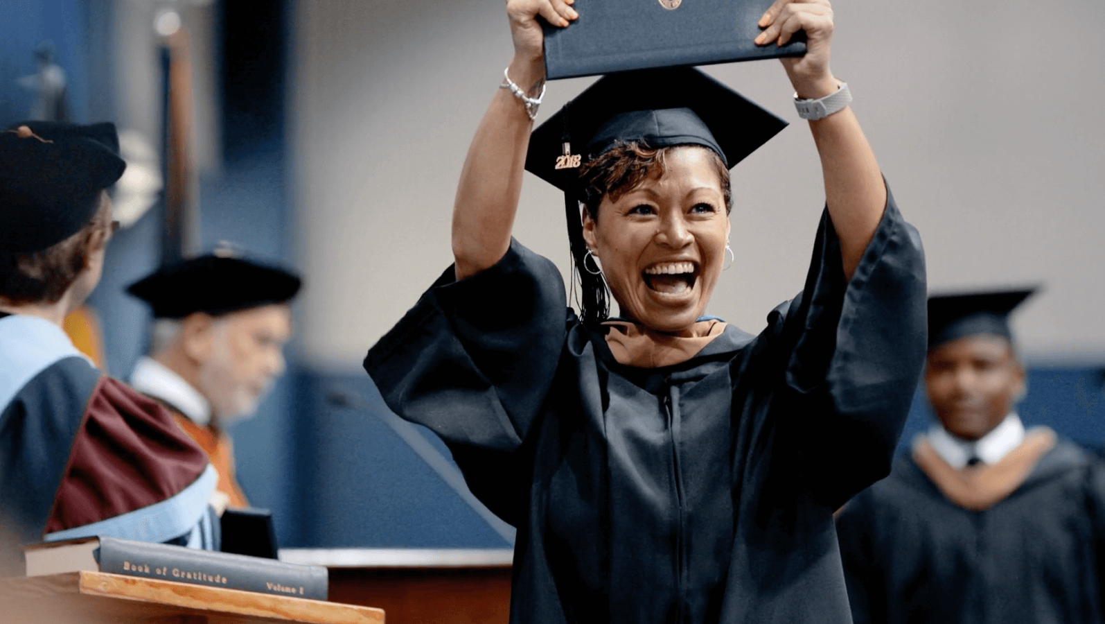 Student_holding_diploma